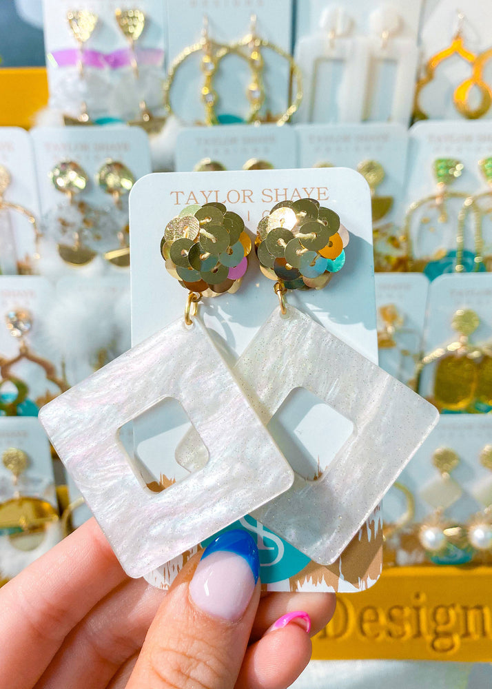 white and gold earrings