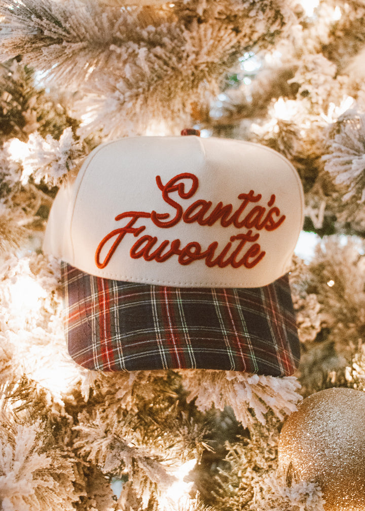 Cap with 'Santa's Favorite' text on a Christmas tree