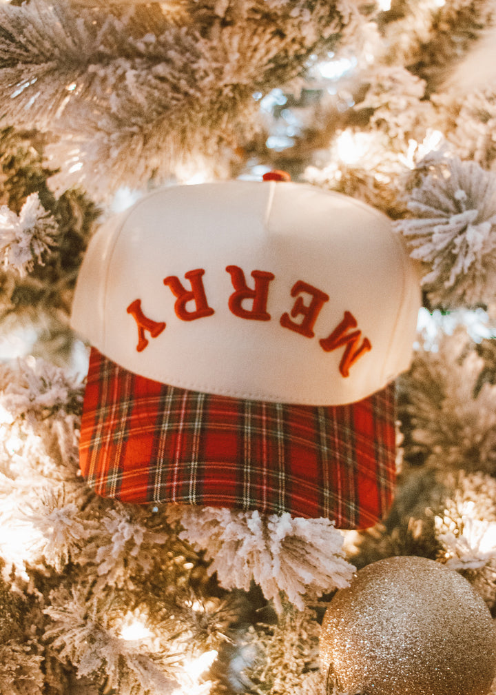Decorative hat with 'Merry' text on a Christmas tree