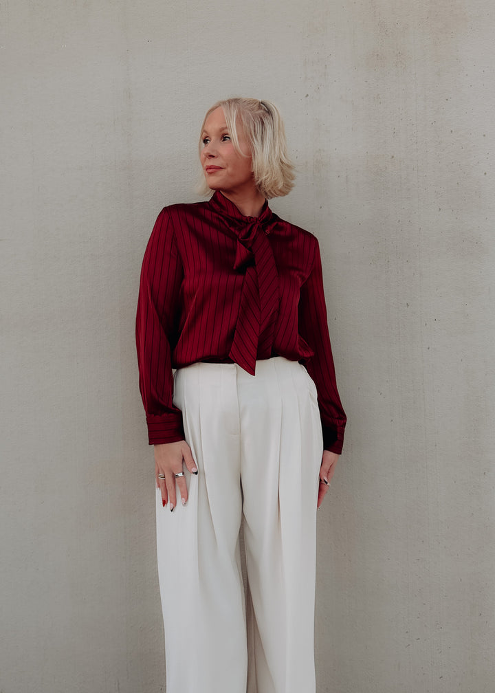 Side of Cranberry Tie Neck Blouse