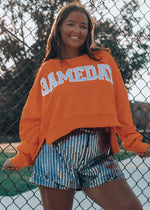 football crewneck, sparkly shorts