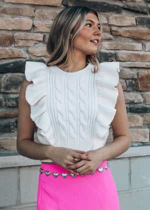 white ruffled sweater