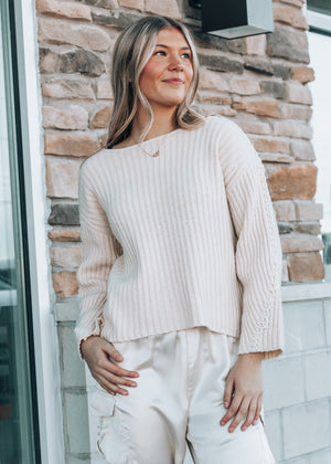 tan sweater