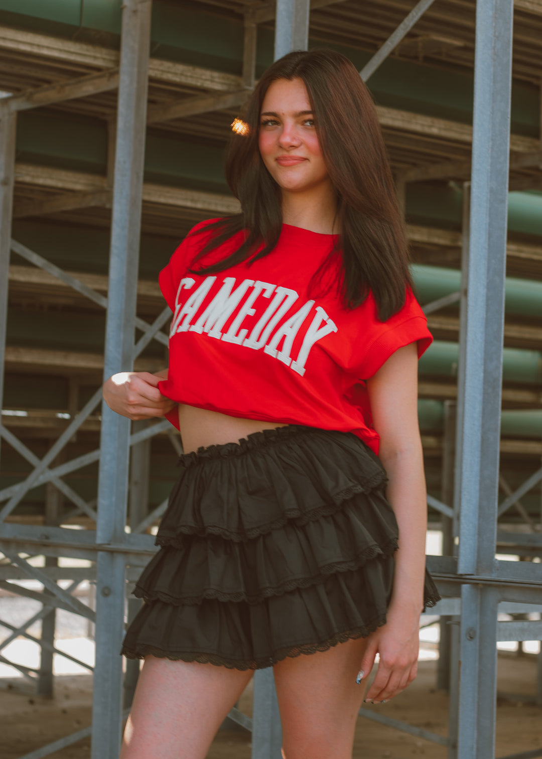 Woman wearing a black tiered skort with lace detailing