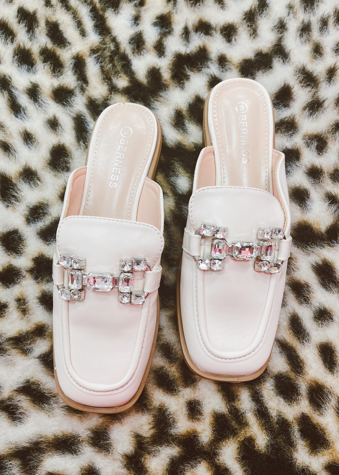 White slip-on shoes with embellishments