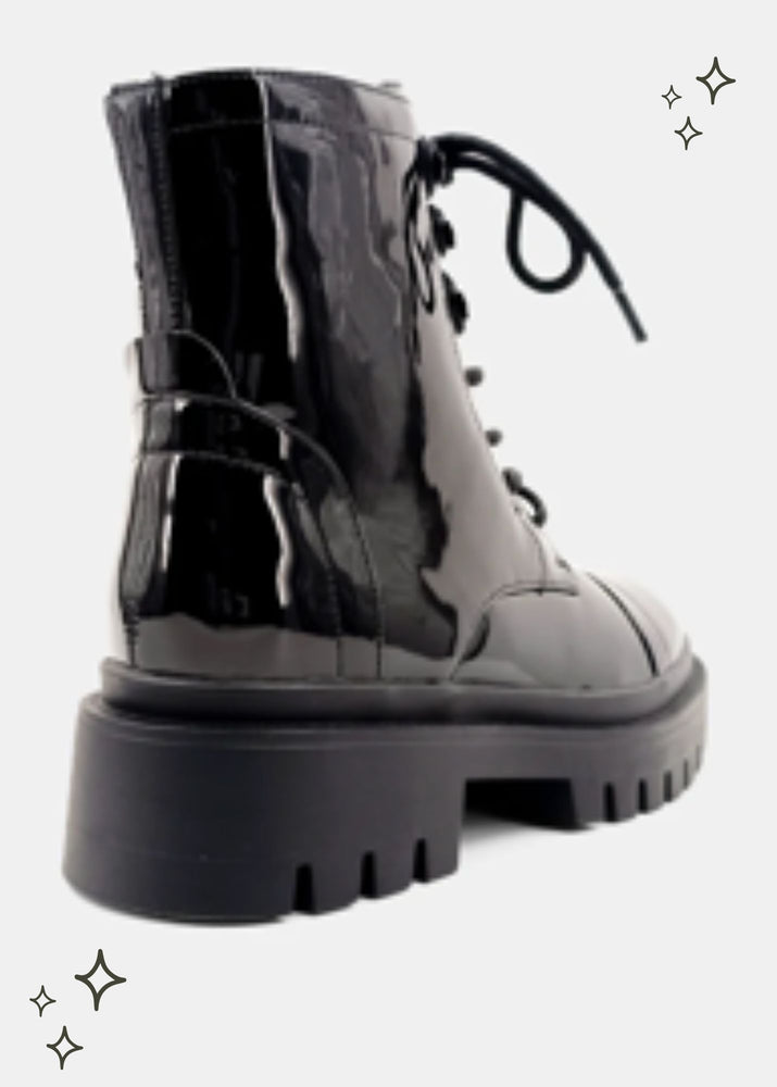 black combat boot featuring a patent finish