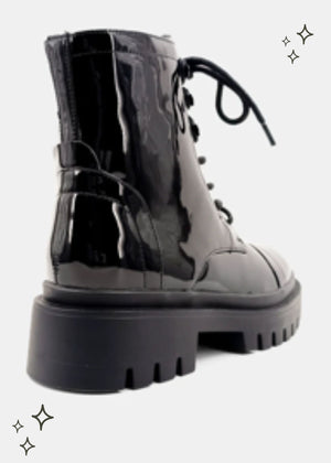 black combat boot featuring a patent finish
