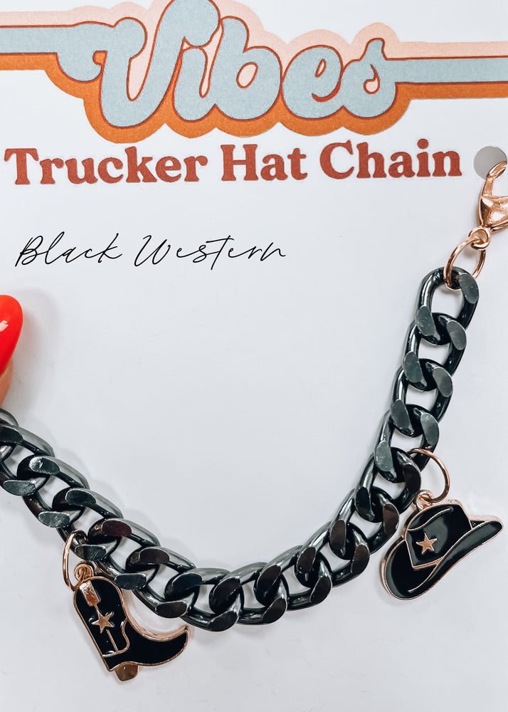 black boots and cowboy hat chain