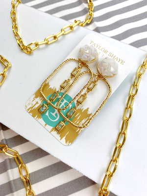 gold and white earrings